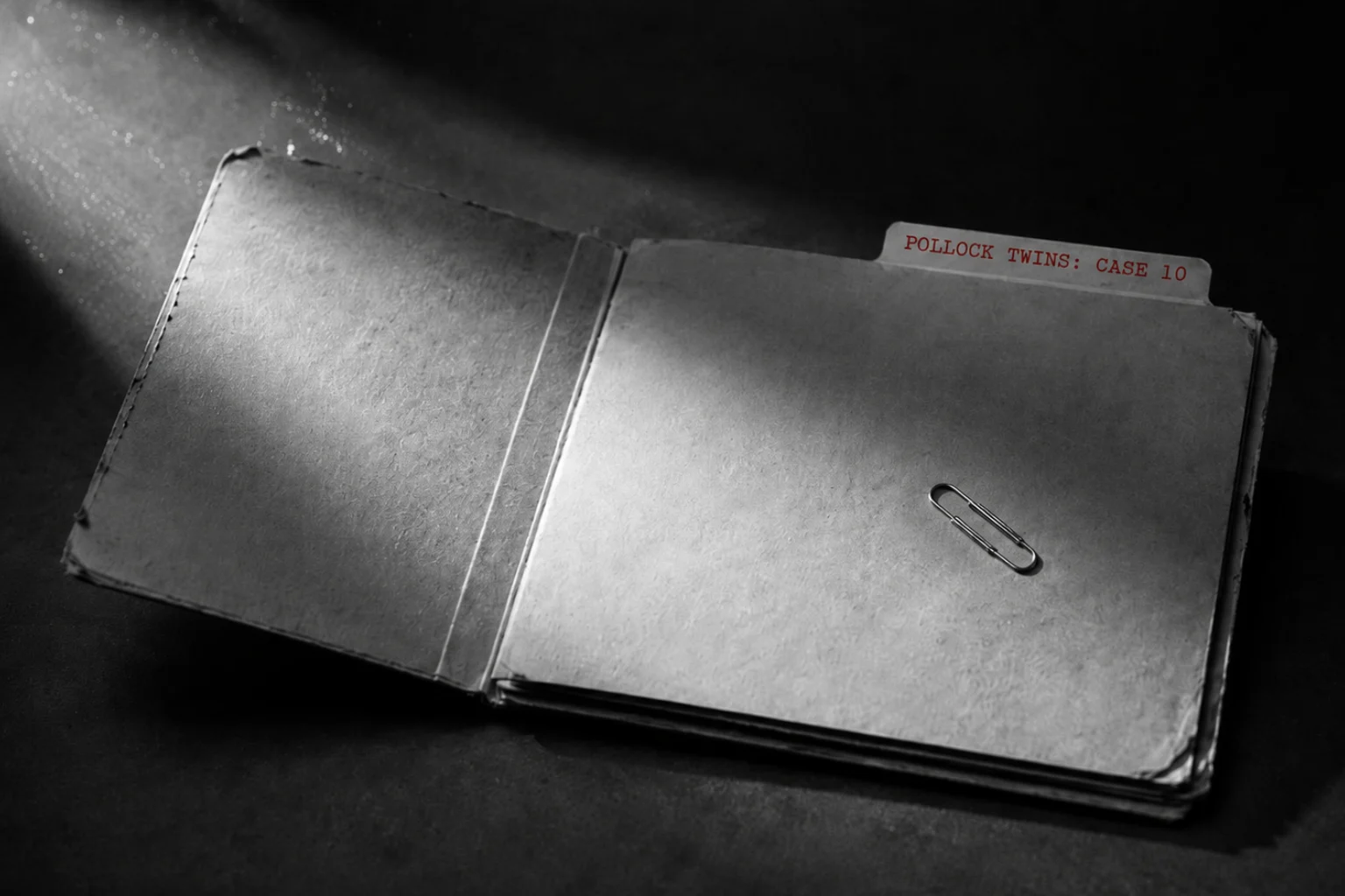 An open, empty manila file folder labeled 'POLLOCK TWINS: CASE 10' on a dark charcoal background, illuminated by a sharp beam of light to highlight the missing records.